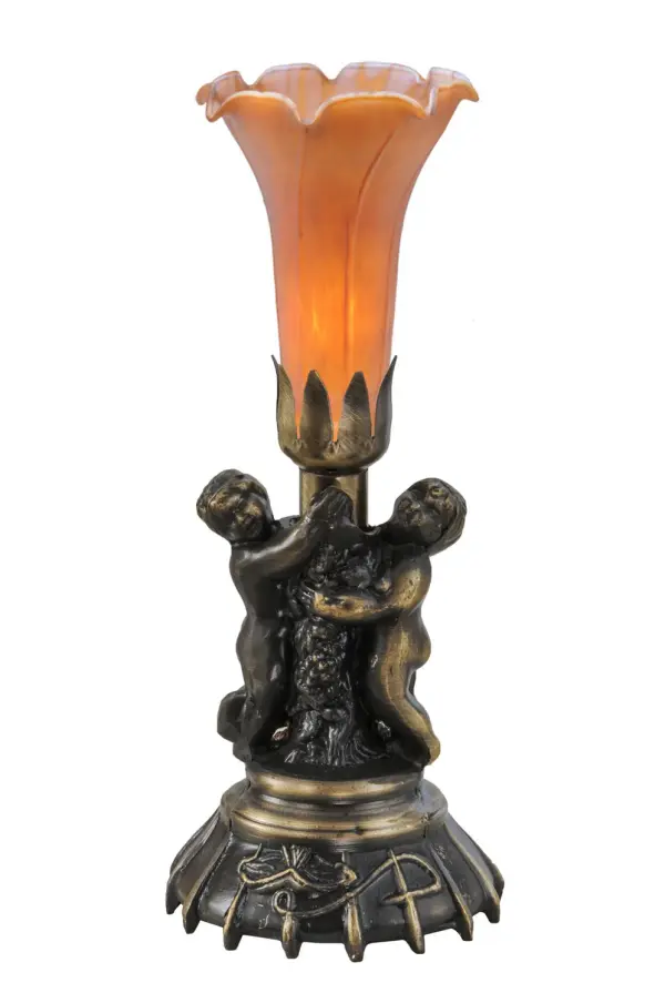 Inspired by the famous Tiffany design from the early 1900s. This mini lamp features a stunning shade mouth blown of fine Amber art glass. The Pond Lily shade is embraced by an elegant cast base featuring two cherubs finished by hand in Antique Brass. The Pond Lily Table Lamp is featured in our American designed, handcrafted Favrile Glass Collection. UL and cUL listed for dry locations. Each shade is a unique work of art with color variations based on natural ingredients inherent in the glass. Contact us if color matching is critical when ordering multiple items. Collection: Amber Finish: Antique Brass Glass: Amber Width: 5.00" Height: 13.00" Length: 5.00" Weight: 2.00 lb Number of Bulbs: 1 Maximum Wattage: 60.00 W Bulb Type: B10 Bulb Base: E12 Material: Zinc Country of Origin: CHINA Safety Listing: Dry Safety Rating: Dry