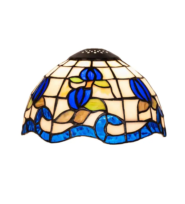 Grace your home with this elegant shade featuring a gridwork of Beige art glass adorned with a Sapphire Blue border of swirling ribbons and Blue rosebuds with Spring Green Leaves. Crafted of hand-cut art glass using the famous Meyda Tiffany copperfoil construction process. The lighting design is inspired by renowned rose gardens in the New York Botanical Garden in Bronx Park, New York City, and the White House in Washington, D.C. The shade, equipped with a ring, is ideal for use with hardware to build wall sconces and mini pendants to create a beautiful design statement in hallways and kitchen spaces. A Roseborder Shade (110707), equipped with a cap, is available for mini lamps. The Roseborder Shade is featured in our American-designed, handcrafted Stained Glass Lighting Collection. Each shade is a unique work of art with color variations based on natural ingredients inherent in the glass. Collection: Roseborder Glass: Stained Glass Width: 7.00" Height: 5.00" Length: 7.00" Weight: 1.50 lb Country of Origin: CHINA