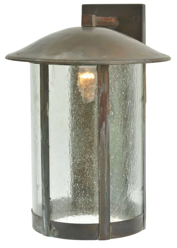 Handcrafted from Solid Copper with handsome rustic beauty for both interior and outdoor lighting applications. This stunning cylindrical shaped lantern features a Clear Seeded Glass lens that is enhanced with a Vintage Copper finish. The Lake Charles Wall Sconce is Domestically Produced in our 180,000 sq ft manufacturing facility in Yorkville, NY at the foothills of the Adirondack Mountains. Customize lantern colors, metal finishes and sconce sizes to meet your exact specifications. UL and cUL listed for dry, damp and wet locations Collection: Lake Charles Finish: Vintage Copper Glass: Clear Seeded Glass Notes: Custom Crafted In Yorkville, New York Please Allow 30 Days Width: 15.00" Height: 22.00" Length: 18.00" Weight: 12.00 lb Extension from Wall: 18.00" Number of Bulbs: 1 Maximum Wattage: 60.00 W Bulb Type: A19 Bulb Base: E26 Material: Copper Country of Origin: USA Safety Listing: Damp Safety Rating: Wet