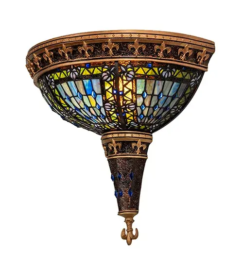 An original Meyda design; this exquisite Fleur-de-Lis inverted shade features an intricate tilework mosaic of Blue; Green; Teal; Mauve; Pink; Purple and Taupe art glass with Blue glass Fleurs surrounded by Chartreuse Yellow/Green and Root Beer accents. This shade is embraced by frame styling; with Gold colored highlighted fleurs and trim on a Mahogany Bronze finish that matches the hardware and decorative accents. Reminiscent of castle and cathedral glass; the Fleur-de-lis holds a prominent place in European Heraldry. The stained-glass fixture was created utilizing Meyda Tiffany's famous copperfoil construction process. The Fleur-de-lis Wall Sconce is featured in our American designed; handcrafted Fleur-de-lis Collection. UL and cUL listed for dry and damp locations. - alternate view