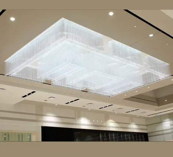 Designed to add large scale fashion, sophistication and volume to the expansive ceiling in the Mall Champlain in Brossard, Quebec in Canada, this custom fixture was engineered and crafted with a clean, elegant two-tier design featuring 1" square Idalight rods. The stunning design was inspired from another Meyda Custom Lighting fixture 32756, which was created for Yves St. Laurent, a high-end clothing store in Miami and evolved over 8 months of working closely with Pappas Design Firm in Montreal, Canada. The design firm selected this fixture because it evokes a timeless classic look that would endure for two decades or more. Equally enduring are the energy efficient LEDs (using only a total of 1,000 watts to power-up). Collection: Mall Champlain Glass: 36L Outer Rods & 48"L Inner" Width: 198.00" Height: 33.00" Length: 330.00" Weight: 3.00 lb Extension from Wall: 5.00" Number of Bulbs: 1 Maximum Wattage: 60.00 W Bulb Type: A19 Bulb Base: E26 Country of Origin: USA Safety Listing: Damp Safety Rating: Damp
