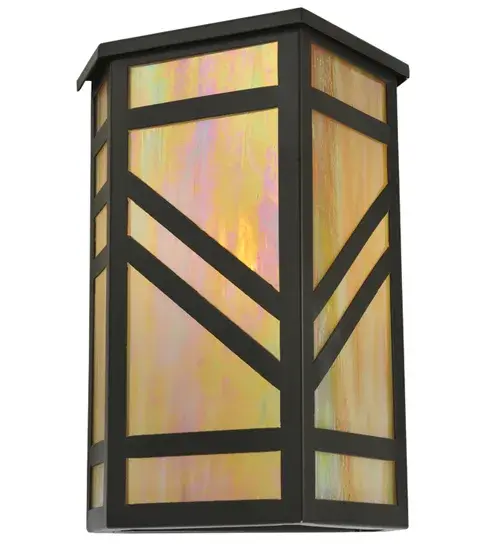 A striking southwestern Mission styled design is featured on the stunning Santa Fe wall sconce. A Beige Iridescent art glass diffuser is combined with bold geometric styling, as well as a frame and hardware in a Timeless Bronze finish. This wall fixture is ideal for ambient decorative lighting in a corridor or any room where you want to make a bold design statement. Handmade in the USA, this sconce is available in custom designs, colors and sizes, as well as with dimmable energy efficient lamping such as LED. The fixture is UL and cUL listed for damp and dry locations. Collection: Santa Fe Finish: Timeless Bronze Glass: Beige Iridescent Glass Notes: Custom Crafted In Yorkville, New York Please Allow 30 Days Width: 11.25" Height: 16.75" Length: 10.25" Weight: 12.00 lb Extension from Wall: 10.25" Number of Bulbs: 1 Maximum Wattage: 60.00 W Bulb Type: A19 Bulb Base: E26 Material: Steel Country of Origin: USA Safety Listing: Damp Safety Rating: Damp - alternate view