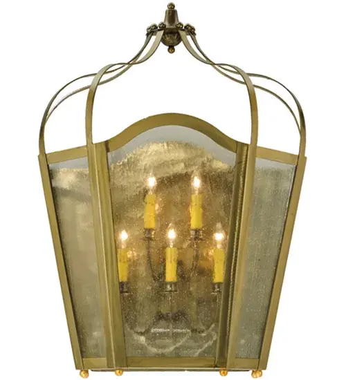 Utilizing a blend of timeless craftsmanship and classic design; the ever-popular Citadel Wall Sconce brings home unsurpassed quality and shapely appeal. Evoking a dramatic effect; beautiful ambient light is projected through Clear Seeded Glass which reveals 5 Ivory faux candlelights featured within. Citadel is enhanced with a curvaceous frame and hardware in a Gold finish. The wall sconce is handcrafted by skilled artisans in our 180;000 square foot manufacturing facility in Yorkville; NY. Custom options include various sizes; colors; designs and dimmable energy efficient lamping. The decorative wall fixture is UL and cUL listed for dry and damp locations. - alternate view