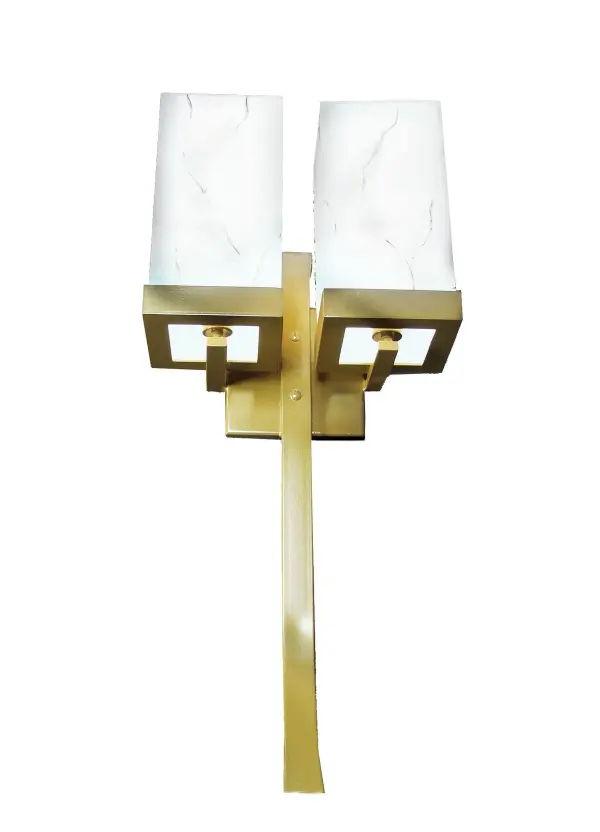 Designed with bold geometric styling; the Laguna Wall Sconce provides the perfect lighting design to illuminate and enhance the beauty of transitional and contemporary settings. Two Statuario Idalight cube shaped diffusers are enhanced with hardware featured in a Buttered Brass finish. The fixture is ideal for illuminating walls in hallways and other rooms in commercial and residential settings. Custom crafted in the USA; this 32-inch tall fixture is available in custom sizes; styles; colors and lamping options such as LED. This handsome wall fixture is UL and cUL listed for dry and damp locations.
