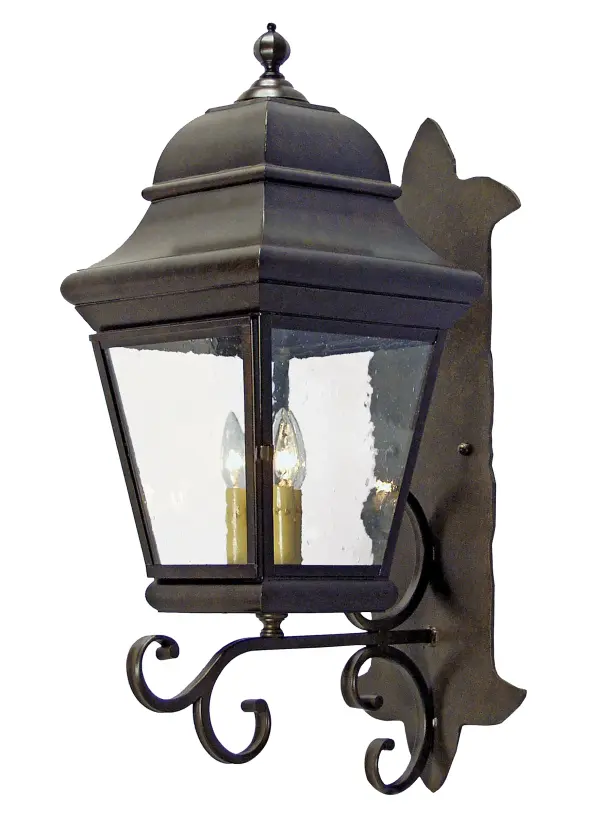 Classic regal styling features a shapely design and elegant scrollwork. A Clear Seeded Glass Lens reveals 3 Amber faux candlelights that project beautiful ambient illumination for fine exteriors and interiors. The exquisite frame, decorative accents and hardware are shown in a Gilded Tobacco finish. Handmade by highly skilled artisans in our 180,000 square foot manufacturing facility in Yorkville, New York, the lantern is available in custom designs, finishes and sizes. Dimmable energy efficient lamping options such as LED are available. UL and cUL listed for dry, damp and wet locations. Collection: Cicero Finish: Gilded Tobacco Glass: Clear Seeded Glass Width: 11.25" Height: 29.00" Length: 16.00" Weight: 31.00 lb Extension from Wall: 16.00" Number of Bulbs: 3 Maximum Wattage: 40.00 W Bulb Type: B10 Bulb Base: E12 Country of Origin: USA Safety Listing: Wet Safety Rating: Wet