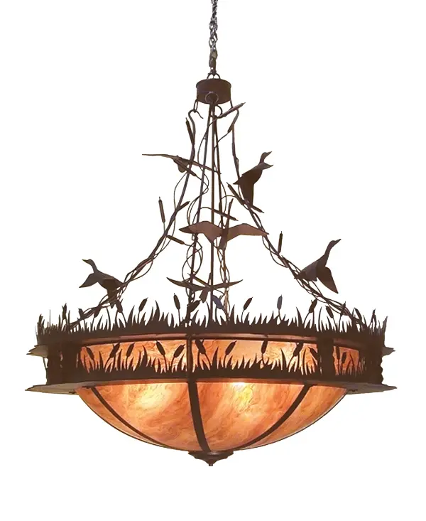With a swoosh climbing sunward comes a flock of Ducks soaring in flight towards the heavens and stretching out above the reeds and marsh. This charming pendant features stunning Amber Quartz Idalight which diffuses soft ambient illumination as decorative accents; hardware and frame are offered in a warm Chestnut finish. Handmade in our manufacturing facility in Yorkville; New York; the fixture is available in custom sizes; designs and colors. Dimmable energy efficient lamping options such as LED are available. The 4-foot wide pendant is UL and cUL listed for damp and dry locations.