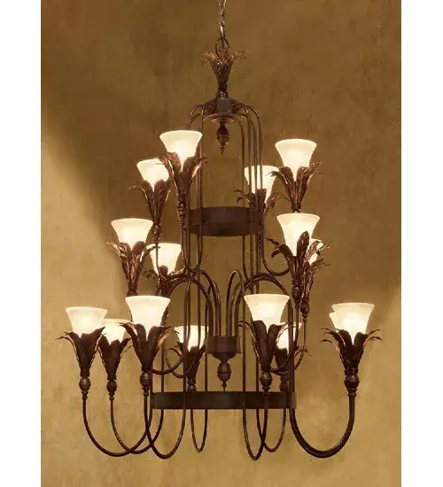 An impressive, artistic lighting masterpiece. Isle makes a design statement in large spaces in residential, hospitality and commercial settings. Stunning Banana Leaves sprout from bobeches that embrace 16 Frosted Clear Glass shades display on graceful curved arms. The hardware and frame are featured in a Copper Rust finish. The chandelier can be created in custom sizes, finishes and diffuser colors. This American fixture is UL and cUL listed for dry and damp locations. Collection: Isle Finish: Copper Rust Glass: Chocolate,Beige Width: 27.00" Height: 16.00" Weight: 102.00 lb Number of Bulbs: 16 Maximum Wattage: 60.00 W Bulb Type: A19 Bulb Base: E26 Material: Steel Country of Origin: USA Safety Listing: Dry Safety Rating: Damp