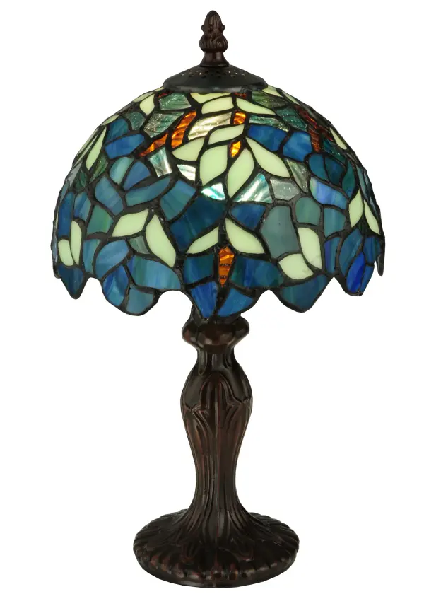 Capture the tranquility of a garden stroll at nightfall with this Nightfall Wisteria mini lamp by Meyda Tiffany. Imagine wandering under darkening skies; past the deepening blooms and climbing vines of the wisteria shrubbery; as you prepare for a restful night of welcome slumber. This beautiful mini lamp; created with blue; blue/green and green art glass using the copperfoil construction process made famous by Louis C. Tiffany in the early 20th century is a masterpiece to be proudly displayed and privately enjoyed in any home or interior setting.