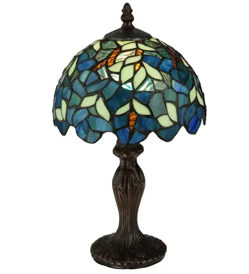 Capture the tranquility of a garden stroll at nightfall with this Nightfall Wisteria mini lamp by Meyda Tiffany. Imagine wandering under darkening skies; past the deepening blooms and climbing vines of the wisteria shrubbery; as you prepare for a restful night of welcome slumber. This beautiful mini lamp; created with blue; blue/green and green art glass using the copperfoil construction process made famous by Louis C. Tiffany in the early 20th century is a masterpiece to be proudly displayed and privately enjoyed in any home or interior setting. - alternate view