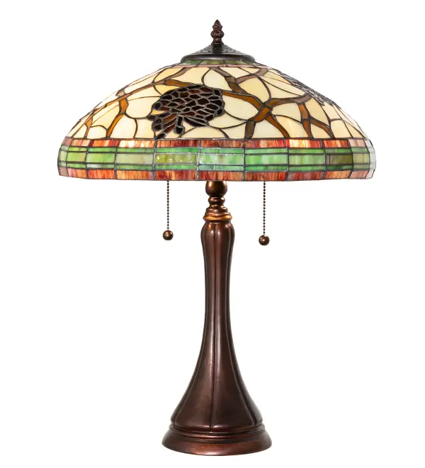 This stunning art glass design features the iconic Pinecone; one of Mother Nature's most compelling organic symbols; which offers natural elegance and represents the evolution of human enlightenment. Burgundy and Leaf Green bands edge this woodland shade; highlighting Light Brown pinecones and Golden Sun branches on a Beige art glass shade. The beautiful shade is created using the famous Meyda Tiffany copperfoil construction technique and complemented with a Mahogany Bronze finished base. Inspired by Pine Trees in renowned American forests; including Deschutes National Forest in central Oregon; Sierra National Forest in the Nevada-Sierra National Forest; and the White Mountain Forest; New Hampshire. The Pinecone Mission Mini Lamp is included in our American-designed; handcrafted Nature Inspired Stained Glass Collection. UL and cUL listed for dry locations.
