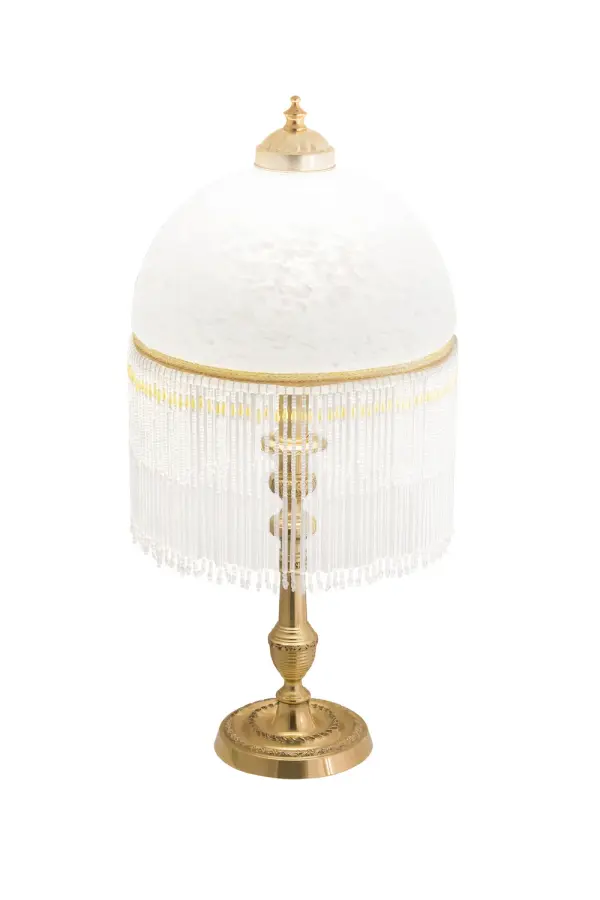 A charming nostalgic accent lamp. This Roussillon Lamp features a stunning White Mottled Glass shade that is color coordinated with delicate White and Gold glass beaded fringe. This Victorian-inspired, intricately detailed shade is combined with a beautifully detailed lamp base in a Brass plated finish. Collection: Roussillon Finish: Mahogany Bronze Glass: White Width: 10.00" Height: 21.50" Length: 10.00" Weight: 4.50 lb Number of Bulbs: 1 Maximum Wattage: 60.00 W Bulb Type: A19 Bulb Base: E26 Material: Brass Country of Origin: CHINA Safety Listing: Dry Safety Rating: Dry