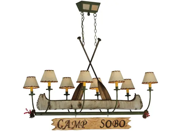 This handsome 8-light chandelier; complete with Tarnished Copper finished steel paddles; perfectly complements your camp; home; lodge; or cabin. Camp Sobo is custom engraved with a hot iron branding on the attached signage. This charming fixture features a faux birch bark Canoe; surrounded by eight curved arms with Faux Leather shades that top Ivory faux candlelights on bobeches. The hardware includes Tarnished Copper finished arms and frame. The chandelier is ideal for illuminating bars; dining tables; kitchen islands; and other residential; hospitality; and commercial spaces. The overall height ranges from 41.50 to 70. Inches as the chain can easily be adjusted on location to meet your lighting needs. The Personalized Canoe 8 Light Chandelier is featured in our American-made; American-designed; handcrafted Personalized Lighting Collection. UL and cUL are listed for dry and damp locations; but we don't recommend installing it in a space that experiences a lot of moisture due to the fabric shade. Please provide us with your family or camp name so we can develop lighting fixtures that bring joy and pride to your home. Call us for pricing and lead time.