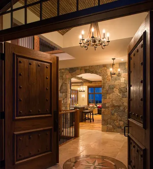Rugged rustic charm greets Gothic styling. This handsome lighting design was inspired by Antique Wooden staves traditionally bound by wooden hoops in the construction of beer/ whiskey barrels and wine casks. Coffee Bean finished solid-stout curved arms support 8 bobeches accented with complementary faux candles on its perimeter. The overall height of this chandelier ranges from 32 to 67 inches as the chain length can be easily adjusted in the field to accommodate your specific lighting application needs. Handcrafted by skilled artisans in our 180;000 square foot manufacturing facility in Yorkville; New York. Candlelight colors; metal finishes and fixture sizes can be customized to your needs. UL and cUL listed for dry and damp locations. - alternate view