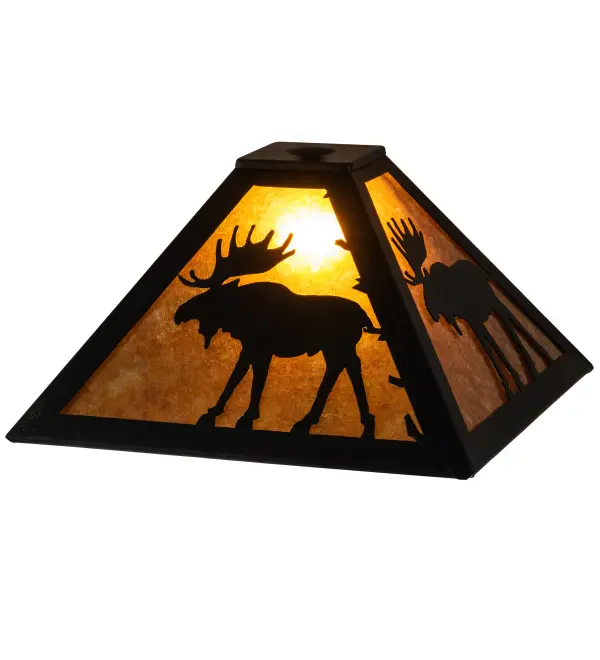 Rustic charm is beautifully captured in this striking shade design of a Moose meandering through the woodlands. Beautiful ambient lighting is created by a stunning Amber Mica diffuser; enhanced with decorative accents and framed in Textured Black. The shade is ideal for pairing with a base to create a table lamp or matched with hardware to build a ceiling pendant. The Moose Shade is featured in our American made; American-designed; handcrafted Wildlife Collection and is manufactured in Yorkville; New York. Upstate New York's adventurous playland; known as the Adirondack Mountains; with its many breathtaking forests; lakes; and rivers; is the spiritual birthplace of Meyda and inspires our rustic-themed collections.