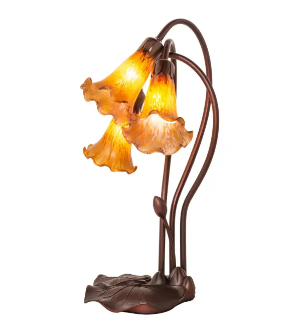 One of the most popular Louis Comfort Tiffany styled lamps on the market today, recreating his famous Favrile design from the early 1900's. This mottled rich Amber shaded 3 Light Accent Lamp offers an attractive, delicate design featuring shades mouth blown of fine art glass. Lily shades are suspended from stems delicately winding above a Lily pad base finished by hand in Mahogany Bronze. Collection: Amber Finish: Mahogany Bronze Glass: Amber Width: 11.00" Height: 16.00" Length: 11.00" Weight: 4.50 lb Extension from Wall: 7.00" Number of Bulbs: 3 Maximum Wattage: 15.00 W Bulb Type: B10 Bulb Base: E12 Material: Zinc Country of Origin: CHINA Safety Listing: Dry Safety Rating: Dry