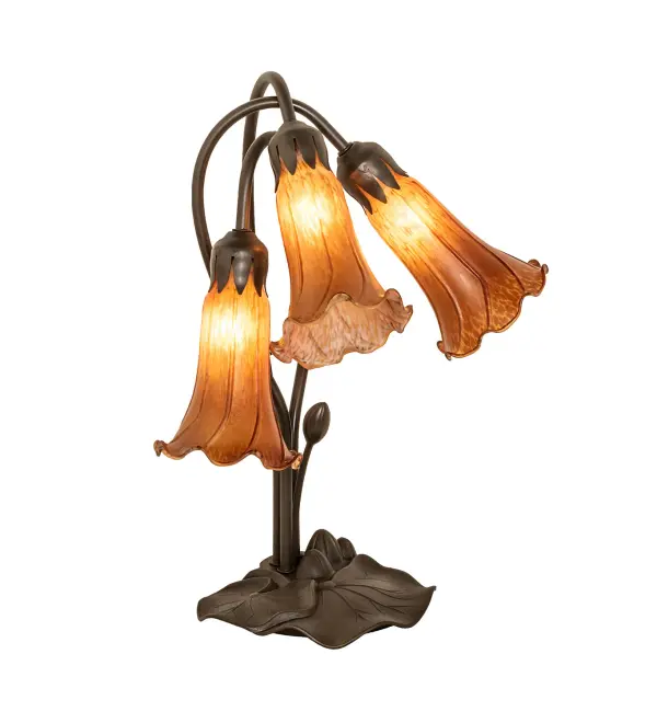 Inspired by Tiffany's famous Pond Lily design from the early 1900s... This table lamp is created with three mouth blown shades featuring Amber art glass. The Pond Lily shades are embraced by an elegant Cast Metal Base featuring a Mahogany Bronze finish. The Pond Lily Table Lamp is featured in our American designed, handcrafted Favrile Style Lighting Collection. UL and cUL listed for dry locations. Each shade is a unique work of art with color variations based on natural ingredients inherent in the glass. Contact us if color matching is critical when ordering multiple items. Collection: Amber Finish: Mahogany Bronze Glass: Amber Width: 13.00" Height: 16.00" Length: 13.00" Weight: 5.00 lb Number of Bulbs: 3 Maximum Wattage: 15.00 W Bulb Type: B10 Bulb Base: E12 Material: Zinc/Steel Country of Origin: CHINA Safety Rating: Dry