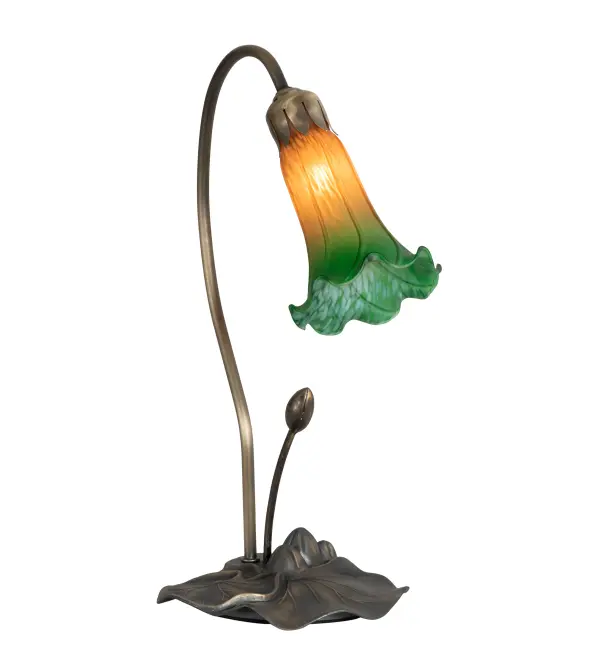 One of the most popular Louis Comfort Tiffany styled lamps on the market today. This Pond Lily accent lamp recreates the famous Favrile design from the early 1900s. The Amber/Green shade features a flowering Lily created from fine mouth blown art glass. The shade is embraced by a delicate metal stem attached to a charming Lily pad base hand finished in Mahogany Bronze. UL and cUL listed for dry locations.