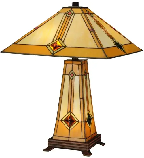 Simple clean lines and a geometric shape are the hallmark of this Mission styled table lamp. The shade is Beige with Honey trim; with Green glass surrounding the Amber cast glass jewel and an Orange diamond. The lamp base is also crafted of stained glass and illuminates as a night light. Both the shade and base are handcrafted using the same technique as the Louis Comfort Tiffany Studio. The lamp includes a 3-way switch so the shade be illuminated; or the base can be lit; or both can be illuminated together. - alternate view