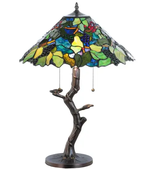 Whet your appetite with color. Spiraling Concord Purple jeweled grape clusters; tasty Ruby Red cherries; Green apples; Vineyard Green grapes and Yellow leaves and Golden Rod vines are depicted on a Blue Sky background in this beautiful stained glass lampshade. A crooked Apple tree styled base finished in Mahogany Bronze complements the shade. - alternate view