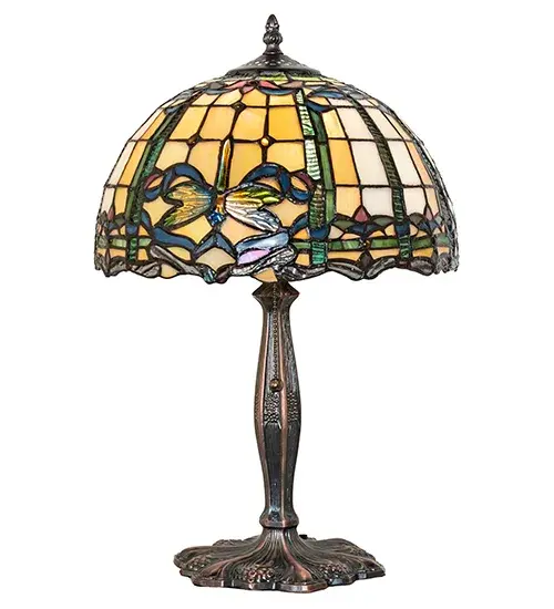 The Dragonfly re-creates Tiffany Studio's most beloved designs in all of its splendor. A stunning Dragonfly flies and dives with glowing Golden Yellow glass eyes; a Sky Blue tail and delicate Blue; Yellow and Green glass wings over hand-cut and copperfoiled pieces of a Blue/Green scroll border. The Beige Iridescent background is separated by White swirled pieces of glass; which is accented with Golden glass jewels. The shade is complemented with a Mahogany Bronze finished table base. - alternate view