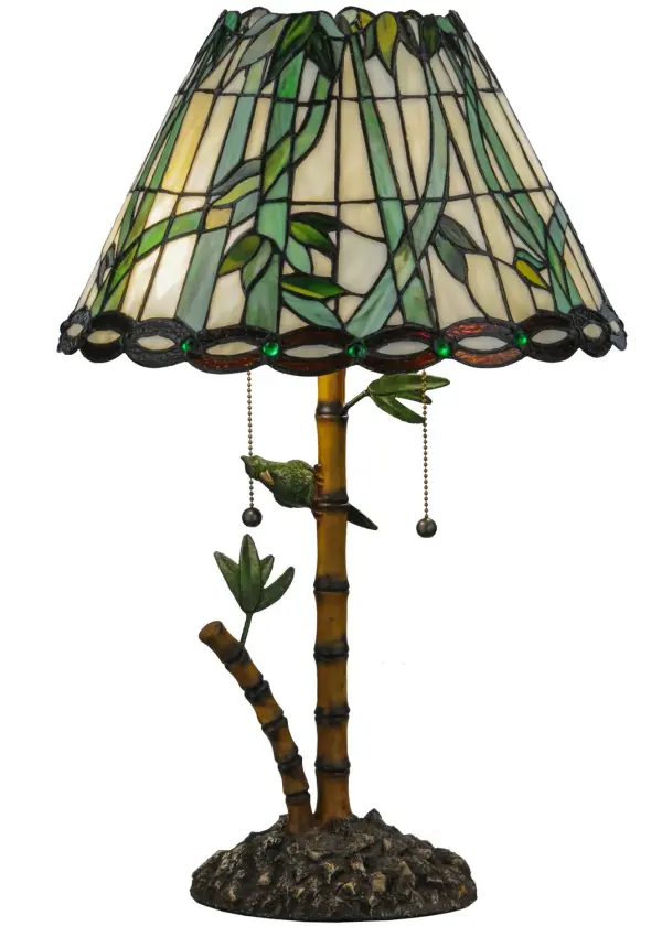 Lovely tropical Flowering Bamboo in Leafy Green adorn this Bone Beige art glass shade, which is trimmed with a Bark Brown ringlet motif with perfectly paired Emerald colored glass jewels on the skirt. The unique, complementary Bamboo styled base is accented with Green leaves and a Parrot while the shade is created with Meyda Tiffany's famous copperfoil construction process. Collection: Loro Paraiso Finish: Faux Bamboo Glass: Green Amber Width: 15.50" Height: 24.00" Length: 15.50" Weight: 9.50 lb Number of Bulbs: 2 Maximum Wattage: 60.00 W Bulb Type: A19 Bulb Base: E26 Material: Bamboo Country of Origin: CHINA Safety Listing: Dry Safety Rating: Dry