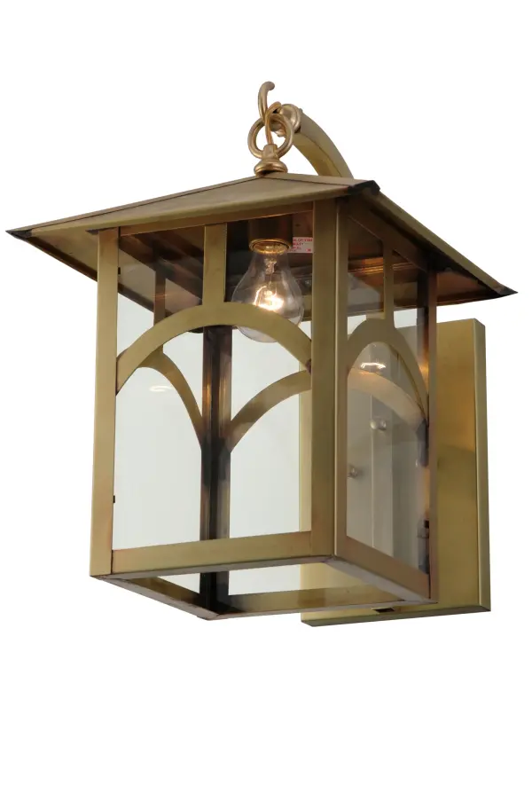 Custom-made from Solid Brass. A stunning Craftsman Signature Seneca design statement is captured with a dramatic Mission-style profile combined with an abstract Hilltop design. The Clear Glass Lens is enhanced with a frame and hardware in a Natural Brass finish. This fixture is ideal for illuminating hallways and entryways in a lake house, man cave, she shed, bar area, or boathouse. The Seneca Hill Top Curved Arm Wall Sconce is featured in our American-made, American-designed, handcrafted Craftsman Signature Series, manufactured in Yorkville, New York. UL and cUL listed for dry, damp, and wet locations. Our Build Your Own Craftsman Signature Series features unlimited combinations of styles. The collection is called Build Your Own because it is fully configurable and customizable from size and design to finish and lens color. Marine-grade, solid brass, or copper raw materials are used to ensure that items from the Craftsman Signature Series of outdoor and indoor lighting will stand the test of time, as these premium metals are impervious to most forms of oxidation. Hand-applied Patina finishes on brass and copper are sealed with a clear varnish and, over time, may require gentle maintenance, such as wax, to delay or reverse the natural living finish attributes indicative of this finishing process. Patina finishes on brass and copper provide strong resistance to fading from sun exposure, will not chip or crack, and will not rust like a steel- framed item in the same conditions. Choose from many style options, or send us your concept today! Call today to learn how to use the configuration tool on our website to get an instant item number. Collection: Seneca Finish: Natural Brass Glass: Clear Glass Width: 12.50" Height: 17.00" Length: 16.50" Weight: 11.00 lb Extension from Wall: 16.50" Number of Bulbs: 1 Maximum Wattage: 60.00 W Bulb Type: A19 Bulb Base: E26 Material: Brass Country of Origin: USA Safety Listing: Damp Safety Rating: Wet