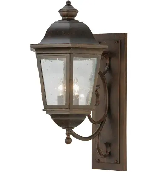 Luxurious elegance and distinctive sophistication are combined to create the Cassandra Lantern Wall Sconce. An elegant Hand-Forged Iron scrolled arm and classic lantern profile feature a Clear Glass Lens that reveals two complementary faux candlelights. The fixture is enhanced with a Coffee Bean finish. This interior/exterior lantern is handcrafted in our 180;000 square foot manufacturing facility in Yorkville; New York. Lantern styles; metal finishes and fixture sizes can be customized to your needs. UL and cUL listed for dry; damp and wet locations. - alternate view