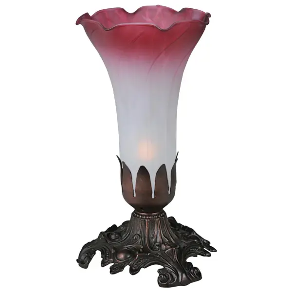 One of the most popular Louis Comfort Tiffany styled lamps on the market today, recreating his famous Favrile design from the early 1900's. This softly mottled Plum Pink and White shaded One Light Accent Lamp offers an attractive, delicate design featuring a shade of mouth blown of fine art glass. Lily shades are seated in an elegant base finished by hand in Mahogany Bronze. Collection: Pink/White Finish: Mahogany Bronze Glass: Pink White Width: 4.00" Height: 7.00" Length: 4.00" Weight: 2.00 lb Number of Bulbs: 1 Maximum Wattage: 40.00 W Bulb Type: B10 Bulb Base: E12 Material: Metal Country of Origin: CHINA Safety Listing: Dry Safety Rating: Dry
