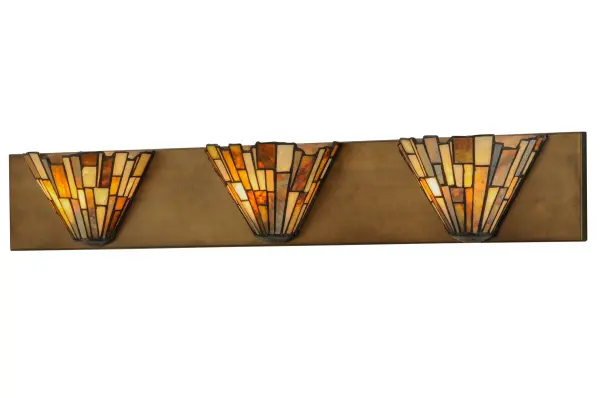 Thinly hand carved and polished natural Jadestone in earthy tones of Moss Green, Tan, Natural Ivory and Coral become luminescent in these unique tile patterned shades and are attached to a backplate finished in Antique Copper. The natural stone shades are crafted using the famous copperfoil construction process that creates Tiffany stained glass lamps and fixtures. Ideal for placement in baths and hallways. Collection: Delta Finish: Antique Copper Glass: Jadestone Width: 4.75" Height: 5.50" Length: 36.00" Weight: 7.50 lb Extension from Wall: 36.00" Number of Bulbs: 3 Maximum Wattage: 60.00 W Bulb Type: B10 Bulb Base: E12 Material: Steel Country of Origin: USA Safety Listing: Damp Safety Rating: Damp