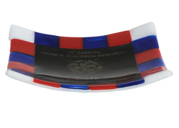 This stunning art glass decorative plate represents a true winner... 1st Place Award for a sporting event. It features the 10th Annual David M. Philipson Memorial Sporting Clays Tournament for 1st Place Class B. The chessboard background design features Blue, Red, and White fused glass boxes. The Personalized Philipson Plate is included in our American-made, American-designed, handcrafted Personalized Collection and manufactured in Yorkville, New York. This decorative art glass plate or any statement-making decorative award can be ordered by calling us and adding your specific designs or names for your next project. Please call for pricing and lead time. Collection: Metro Fusion Finish: Oil Rubbed Bronze Glass: Red/Blue/Gold Width: 8.50" Height: 2.00" Length: 6.00" Weight: 3.00 lb Extension from Wall: 6.00" Number of Bulbs: 2 Bulb Type: A19 Bulb Base: Medium Material: Steel Country of Origin: USA Safety Listing: Dry Safety Rating: Dry