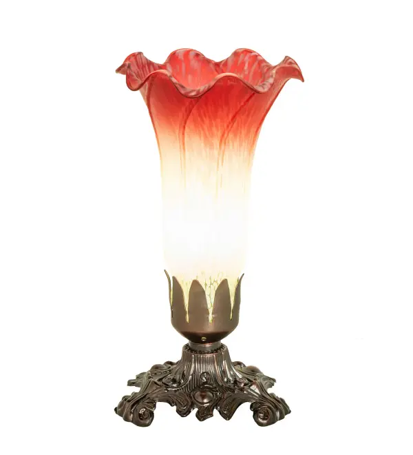 Inspired by the famous Tiffany design from the early 1900s. This mini lamp features a stunning shade mouth blown of Seafoam and Cranberry art glass. The Pond Lily shade is embraced by an elegant Victorian cast metal base finished by hand in Mahogany Bronze. The Pond Lily Table Lamp is featured in our American designed, handcrafted Favrile Glass Collection. UL and cUL listed for dry locations. Each shade is a unique work of art with color variations based on natural ingredients inherent in the glass. Contact us if color matching is critical when ordering multiple items. Collection: Seafoam/Cranberry Finish: Mahogany Bronze Glass: Seafoam/Cranberry Width: 4.00" Height: 7.50" Length: 4.00" Weight: 2.00 lb Number of Bulbs: 1 Maximum Wattage: 40.00 W Bulb Type: B10 Bulb Base: E12 Material: Zinc Country of Origin: CHINA Safety Rating: Dry