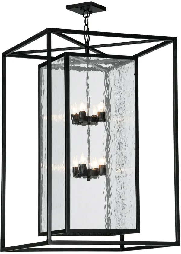 A sophisticated architecturally styled fixture is designed with a pizazz that is unique, fresh and stylish. Give your decor an extra edge with this breathtaking pendant, which is highlighted with a solid metal structure that surrounds a Clear Water Glass Lens. The sturdy hardware and frame are featured in a handsome Solar Black finish. Handcrafted in the USA, Kitzi is available in custom sizes, styles and finishes, as well as dimmable energy efficient lamping options. The 28-inch square fixture is UL and CUL listed for dry and wet locations. Collection: Kitzi Box Finish: Solar Black Glass: Clear Waterglass Width: 39.00" Height: 49.00" Length: 28.00" Weight: 71.00 lb Number of Bulbs: 8 Maximum Wattage: 60.00 W Bulb Type: F15 Bulb Base: E26 Material: Steel Country of Origin: USA Safety Listing: Damp Safety Rating: Damp