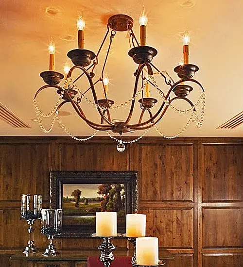 Distinctive luxury integrated with graceful elegance is defined with Jaya. The classic chandelier reveals waves of Crystal Beaded Garland and a Crystal Orb accent. 8 Amber faux candlelights are perched on shapely bobeches embraced by curved arms on the fixture. Handcrafted in Yorkville, New York, this 32-inch wide ceiling fixture is available in custom sizes, designs and colors. Dimmable energy efficient lamping options such as LED are offered. The chandelier is UL and cUL listed for dry and damp locations. Collection: Jaya Finish: Crystal Width: 32.00" Height: 24.00" Length: 32.00" Weight: 26.00 lb Number of Bulbs: 8 Maximum Wattage: 40.00 W Bulb Type: BA9 Bulb Base: E12 Material: Steel Country of Origin: USA Safety Rating: Damp