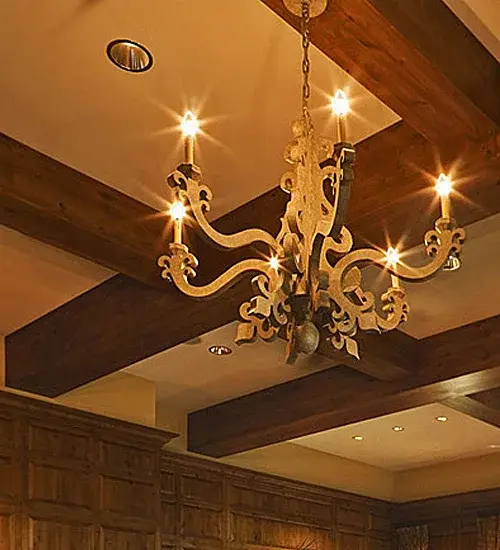 Elaborate scrollwork, curvaceous arms, and a charming finial hand-finished in Tuscan Ivory are the hallmarks of this mesmerizing chandelier. Six Ivory faux candlelights deliver beautiful ambient illumination for nearly any space. This fixture makes the perfect centerpiece for living spaces and dining rooms in homes and hotels from Concord, New Hampshire, to Lincoln, Nebraska. The Tristan 6 Light Chandelier is featured in our American-made, American-designed, handcrafted Traditional Lighting Collection, which is manufactured in the USA. UL & cUL listed for dry and damp locations. Collection: Tristan Finish: Tuscan Ivory Width: 45.00" Length: 45.00" Weight: 122.00 lb Number of Bulbs: 6 Maximum Wattage: 40.00 W Bulb Type: BA9 Bulb Base: E12 Country of Origin: USA Safety Rating: Damp