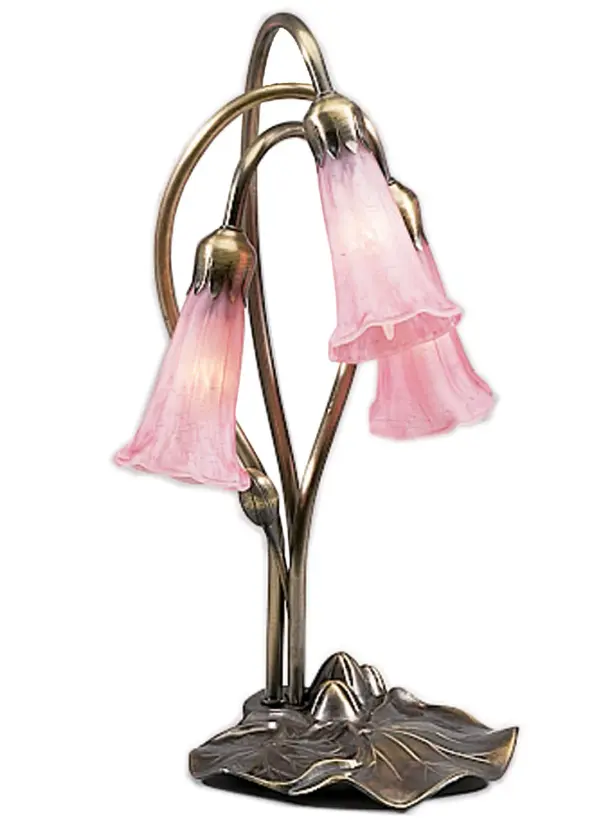 One of the most popular Louis Comfort Tiffany styled lamps on the market today, recreating his famous Favrile design from the early 1900's. This softly mottled Petal Pink shaded 3 Light Accent Lamp offers an attractive, delicate design featuring shades mouth blown of fine art glass. Lily shades are suspended from stems delicately winding above a Lily pad base finished by hand in Mahogany Bronze. Collection: Pink Finish: Mahogany Bronze Glass: Pink Width: 11.00" Height: 16.00" Length: 11.00" Weight: 2.00 lb Extension from Wall: 4.50" Number of Bulbs: 3 Maximum Wattage: 15.00 W Bulb Type: B10 Bulb Base: E12 Material: Zinc Country of Origin: CHINA Safety Listing: Dry Safety Rating: Dry
