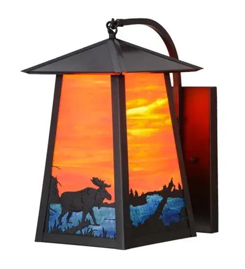 A majestic Moose meanders alongside a woodland lake as the brilliant morning sun rises at dawn. This Craftsman Signature design makes an image that is perfect for picture postcards and great works of art. Eye-catching Sunburst Opal art glass depicts the sky as Blue-Green Ripple art glass represents the water. The wall sconce features decorative accents and hardware in a Craftsman Brown finish. Made to Order in our 180,000 square foot manufacturing facility in Yorkville, New York, located at the foothills of the Adirondack Mountains. Additional wildlife and custom designs available, as well as custom shade colors, finishes and sconce sizes. UL and cUL listed for damp, dry and wet locations. Collection: Stillwater Finish: Craftsman Brown Glass: Orange And Blue Green Art Glass Width: 10.00" Height: 18.00" Length: 14.00" Weight: 12.00 lb Extension from Wall: 14.00" Number of Bulbs: 1 Maximum Wattage: 60.00 W Bulb Type: A19 Bulb Base: E26 Material: Brass Country of Origin: USA Safety Listing: Wet Safety Rating: Wet - alternate view
