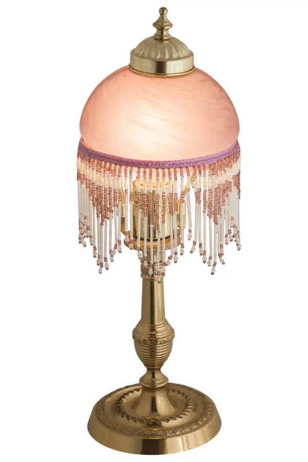 A charming nostalgic accent lamp. This Roussillon Lamp features a stunning Pink Art Glass shade that is color coordinated with delicate Gold and White glass beaded fringe. This Victorian-inspired, intricately detailed shade is combined with a beautifully detailed lamp base in a Brass plated finish. Collection: Roussillon Finish: Polished Brass Glass: Pink Width: 5.25" Height: 17.00" Length: 5.25" Weight: 7.50 lb Extension from Wall: 11.50" Number of Bulbs: 1 Maximum Wattage: 60.00 W Bulb Type: A19 Bulb Base: E26 Material: Steel Country of Origin: CHINA Safety Listing: Dry Safety Rating: Dry
