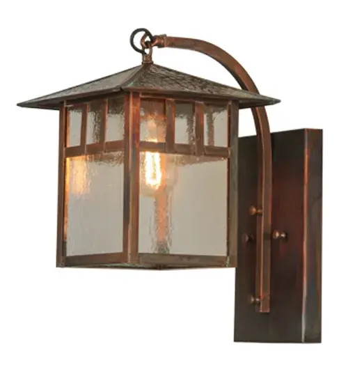 Custom Crafted of Solid Brass.Mission inspired straight lines and a hammered peaked roof are depicted as a handsome American Craftsman Signature style.Ambient light projects through Clear Seeded art glass enhanced with Solid Brass hardware and frame featured in a Vintage Copper finish.Ideal for covered porches; entryways and hallways.Handcrafted by Meyda artisans in the Yorkville; NY manufacturing facility at the foothills of the Adirondack Mountains. Custom colors; styles and sizes available.Energy efficient lamping options. - alternate view
