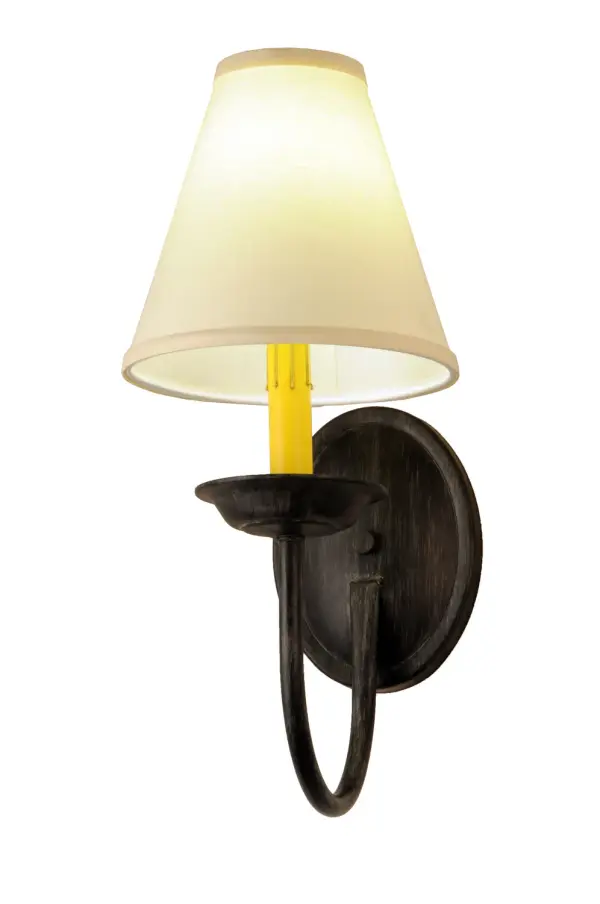 Offering a refined, distinguished look that will complement the most luxurious interiors... The Perouges wall sconce creates soft illumination and sophistication with an elegant material palette. The Parchment shade is perched on an Ivory faux candlelight and complemented with an Antique Iron Gate finish. The wall fixture is perfect for illuminating hallways and dining spaces in fine homes and hospitality spaces from Hialeah, Florida, to Garland, Texas, to Glendale, Arizona. The Perouges Wall Sconce is featured in our American-made, American-designed, handcrafted Modern Collection. UL and cUL listed for dry and damp locations, however, we do not recommend placing it in spaces that experience a large amount of moisture due to the fabric shade. Collection: Perouges Finish: Antique Iron Gate Glass: Eggshell Linen Width: 7.00" Height: 16.00" Length: 11.00" Weight: 1.00 lb Extension from Wall: 11.00" Number of Bulbs: 1 Maximum Wattage: 60.00 W Bulb Type: B10 Bulb Base: E12 Material: Steel Country of Origin: USA Safety Listing: Damp Safety Rating: Damp