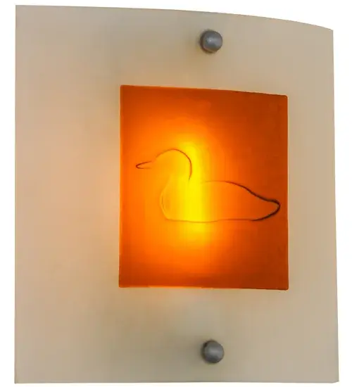 A subtle yet stunning impression of the aquatic Loon design is featured in Amber fused glass on a Clear Frosted Glass background. The geometric wildlife inspired sconce with a contemporary look embraces the wall with Nickel powder coated hardware. Handcrafted in our manufacturing facility at the foothills of the Adirondack Mountain lake country in Upstate NY. Custom sizes, styles, and colors are available, as well as dimmable energy efficient lamping options such as LED. The ADA Compliant sconce is UL and cUL listed for dry and damp locations. Collection: Metro Fusion Finish: Nickel Glass: Clear/Amber Bas Relief Dragonfly Width: 11.00" Height: 11.00" Length: 3.00" Weight: 3.50 lb Extension from Wall: 3.00" Number of Bulbs: 1 Maximum Wattage: 60.00 W Bulb Type: T10 Bulb Base: E26 Material: Steel Country of Origin: USA Safety Listing: Damp Safety Rating: Damp - alternate view
