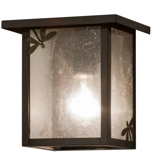 A charming Dragonfly darts across the edge of this handsome American Craftsman-style wall luminaire. This Hyde Park Dragonfly sconce projects beautiful ambient light through Frosted Seeded Glass panels; which are accented with a delicate Dragonfly silhouette design. The fixture is enhanced with a Craftsman Brown finish. Constructed of Solid Brass; this lighting fixture is handcrafted for durability and longevity and is resistant to rust and corrosion. The wall fixture is perfect for illuminating the interior and exterior of timber homes; modern farmhouses; and other spaces from Traverse City; Michigan; to Lake Tahoe; Nevada; to Lake Geneva; Wisconsin. The Hyde Park Dragonfly Wall Sconce is included in our American-made; American-designed; handcrafted Craftsman Signature Series and manufactured in Yorkville; New York. UL and cUL listed for dry; damp; and wet locations. Our Build Your Own Craftsman Signature Series features unlimited combinations of styles. The collection is called build your own because it is fully configurable and customizable from size and design to finish and lens color. Go nuts with the options; or send us your own concept today! Call today to learn how to use the configuration tool available on our website for an instant item number! - alternate view