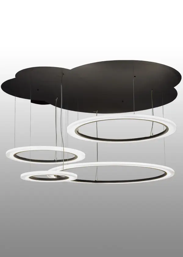 Modern sophisticated system featuring extraordinary elements of light. Eliptic Crystal Idalight rings illuminate and appear to float in space with a dramatic interplay of light and shadow. Supported by sturdy aircraft cables to Solar Black finished cloud canopy. Energy saving; maintenance free LED arrays deliver ambient illumination with long life; strong CRI and lumen output with full range dimming. Custom crafted in our 180;000 square foot manufacturing facility in Yorkville; New York.