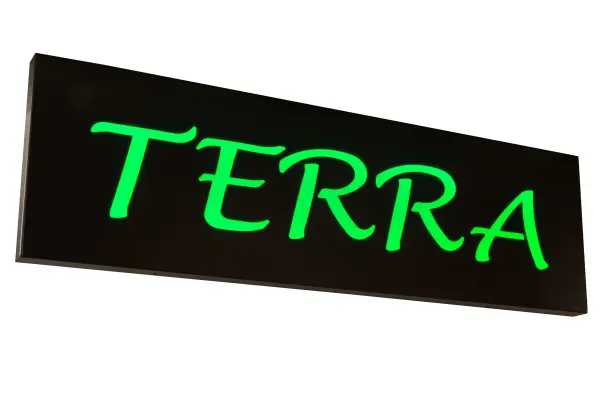 A custom crafted sign featuring the Terra logo is illuminated with 360 Green LEDs Statuario Idalight; which is highlighted on a metal frame hand finished in an Oil Rubbed Bronze. Integral energy efficient LEDs minimize energy usage; maintenance and provide long lamp life. UL and cUL listed for dry and damp locations. Handcrafted in the USA; Meyda offers complete custom capabilities to create personalized signs; decorative accessories and lighting fixtures featuring any design; company name or logo. Personalized items are shown as examples of our craftsmanship (only.) They are not for sale 'as is' but can be customized to fit your personal needs.