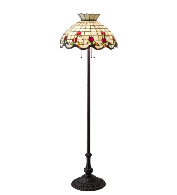Grace your home with this elegant floor lamp featuring a crowned art glass shade. The shade highlights a gridwork of Beige Art Glass, adorned with a Mauve Waterglass border of swirling ribbons and perfect Red rosebuds accented with Green leaves. The stained glass shade is created with the famous Meyda Tiffany copperfoil construction process and complemented with an elegant cast metal floor base in a Mahogany Bronze finish. This lighting design is inspired by famous rose gardens in the New York Botanical Garden in Bronx Park, New York City, to the White House in Washington, D.C. It is ideal for placement in residential and hospitality spaces to create a beautiful design statement. The Roseborder Floor Lamp is featured in our American-designed, handcrafted Stained Glass Lighting Collection. UL & cUL listed for dry locations. Each shade is a unique work of art with color variations based on natural ingredients inherent in the glass. Collection: Roseborder Finish: Mahogany Bronze Glass: Ba Br 59 Xag Width: 20.50" Height: 62.00" Length: 20.50" Weight: 21.50 lb Number of Bulbs: 3 Maximum Wattage: 60.00 W Bulb Type: A19 Bulb Base: E26 Material: Zinc/Steel Country of Origin: CHINA Safety Listing: Damp Safety Rating: Dry