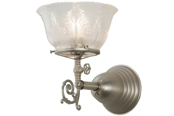Step back in time with a traditional glass, fit and finish. Reminiscent of lighting fixtures from the early 1900s, the Clear Textured Revival glass shade offers an authentic historic look to complement any room or space. Brushed Nickel finished hardware and accents make this piece a timeless treasure. The fixture is handcrafted by Meyda artisans in Yorkville, New York in the USA. Collection: Revival Finish: Brushed Nickel Glass: Clear Textured Glass Width: 7.50" Height: 9.50" Length: 11.00" Weight: 2.50 lb Extension from Wall: 11.00" Number of Bulbs: 1 Maximum Wattage: 60.00 W Bulb Type: CA10 Bulb Base: E26 Material: Brass Country of Origin: USA Safety Listing: Damp Safety Rating: Damp