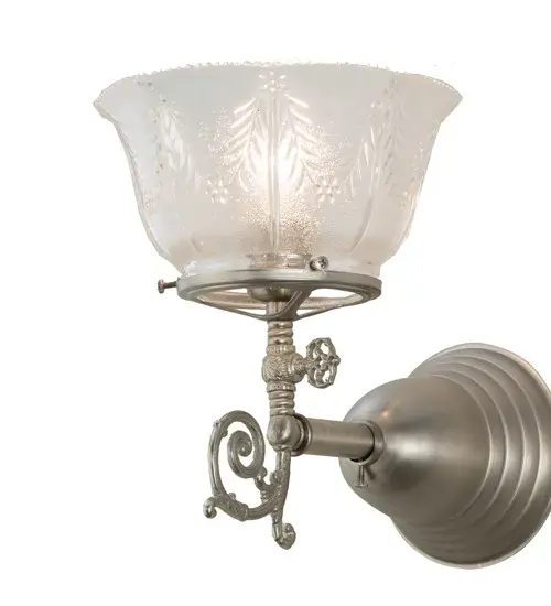 Step back in time with a traditional glass, fit and finish. Reminiscent of lighting fixtures from the early 1900s, the Clear Textured Revival glass shade offers an authentic historic look to complement any room or space. Brushed Nickel finished hardware and accents make this piece a timeless treasure. The fixture is handcrafted by Meyda artisans in Yorkville, New York in the USA. Collection: Revival Finish: Brushed Nickel Glass: Clear Textured Glass Width: 7.50" Height: 9.50" Length: 11.00" Weight: 2.50 lb Extension from Wall: 11.00" Number of Bulbs: 1 Maximum Wattage: 60.00 W Bulb Type: CA10 Bulb Base: E26 Material: Brass Country of Origin: USA Safety Listing: Damp Safety Rating: Damp - alternate view