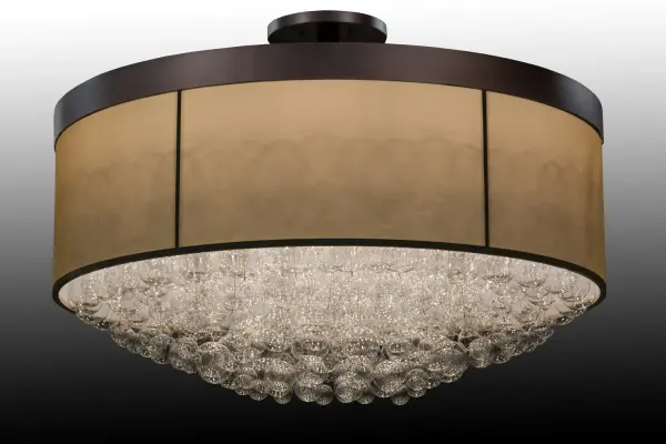 An ethereal, massive centerpiece for any residential, hospitality, or commercial space... This mesmerizing ceiling fixture design comes to light as perfectly formed, sphere-like Crystal Bubbles appear to flow as the light from 22 lamps makes them gleam like magic. The stunning and unique Cilindro Bulle Flushmount features 72 Clear Crystal Miniature Orbs. A handsome hub features a Mahogany Bronze finish with Macadamia-finished accents that support the frame. See this fixture without the fabric shade, the 72 Wide Bulle Semi-Flushmount, model 163979. The Bulle Semi-Flushmounts are included in our American-made, American-designed Modern Lighting Collection. The eye-catching ceiling fixtures are manufactured in Yorkville, New York. It is UL and cUL listed for dry and damp locations." Collection: Cilindro Finish: Mahogany Bronze/Macadamia Glass: Dark Gold Organza Width: 72.00" Height: 50.00" Length: 72.00" Weight: 475.00 lb Number of Bulbs: 15 Maximum Wattage: 12.00 W Bulb Type: A19 OMNI Bulb Base: E26 Light Source: LED Material: Steel Country of Origin: USA Safety Listing: Damp Safety Rating: Damp LED