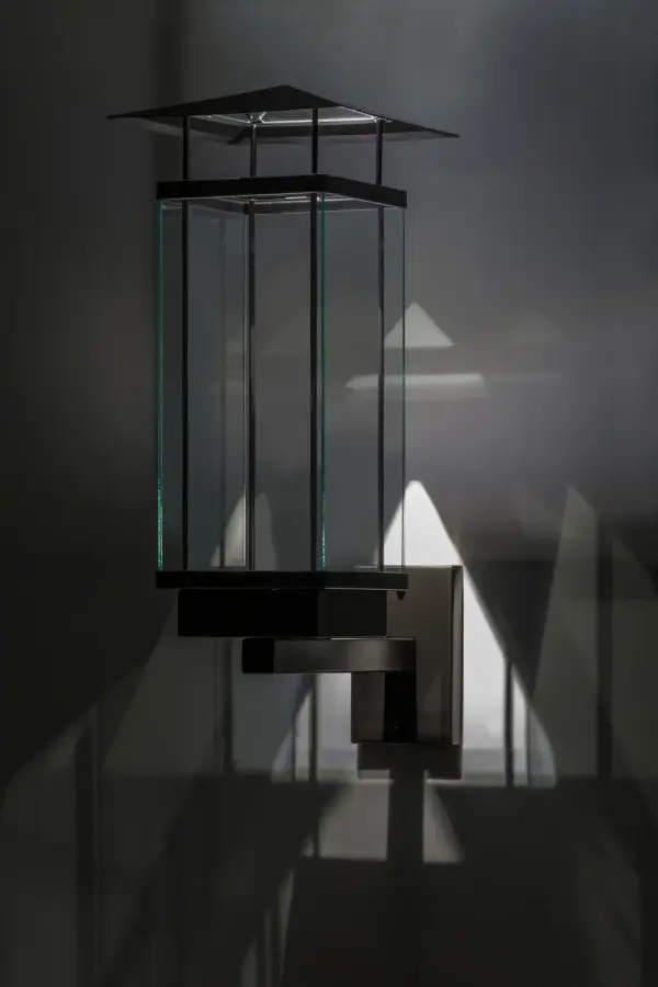 Create eye-catching drama and bold special effects to any setting with stunning geometric images of ambient light projected by Chiaro, which is specially designed with a custom mirror reflector. This architecturally designed wall sconce features a Clear glass diffuser with a frame, hardware and a raised roof hand finished in Oil Rubbed Bronze. The energy efficient LED lamp delivers outstanding quality of light while providing energy savings, reduced maintenance and a long lamp life. The fixture is ideal for outdoor and indoor applications and handcrafted in the USA. Custom sizes, styles and colors are available, as well as lamping options. Collection: Chiaro Finish: Exterior Oil Rubbed Bronze Glass: Clear Glass Width: 11.00" Height: 28.00" Length: 18.50" Weight: 18.00 lb Extension from Wall: 18.50" Number of Bulbs: 1 Maximum Wattage: 3.00 W Bulb Type: SPOTLIGHT Bulb Base: INTEGRAL Light Source: LED Material: Steel Country of Origin: USA Safety Listing: Wet Safety Rating: Wet LED