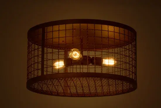 Discover a unique decorative look and lighting design with this dramatic caged frame and exposed Edison lamp sprocket configuration displayed from within. The solid steel hardware and grill is featured in a stunning Vintage Copper finish. Handcrafted by Meyda artisans in the USA; this fixture is offered in a myriad of custom lamping options; as well as sizes; designs and finishes. The fixture is UL and cUL listed for damp and dry locations.