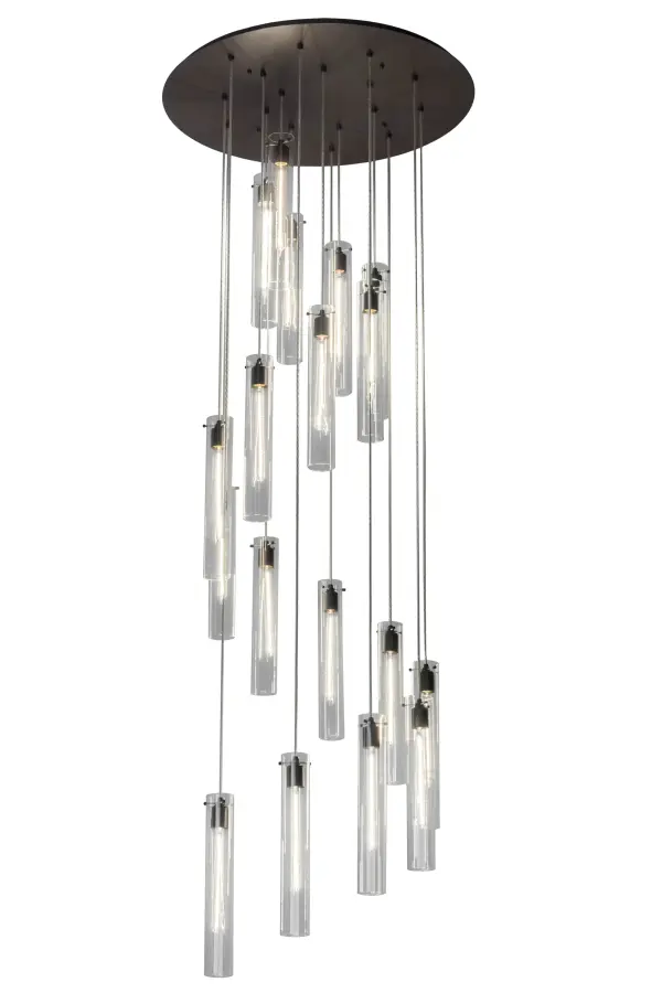 A dazzling array of cylindrical elements cascading at various heights. This Cilindro Pendant features 18 cylindrical-shaped Clear Glass diffusers that reveal Edison-styled filament-shaped lamps while evoking beautiful ambient illumination. The striking diffusers are paired with metal hardware in a Timeless Bronze Finish. The overall height of each element ranges from 20 to 100 inches as the aircraft cable easily adjusts in the field to meet your precise lighting specifications. Ideal for illuminating entryways and stairwells in fine residential; commercial; and hospitality spaces throughout the US; from Hartford; Connecticut; to Madison; Wisconsin; to Portland; Oregon. The Cilindro Cascading Pendant is included in our American-made; American-designed; handcrafted Contemporary Lighting Collection that is manufactured in Yorkville; New York. UL and cUL listed for dry and damp locations. Custom made. Please call for lead time and pricing.